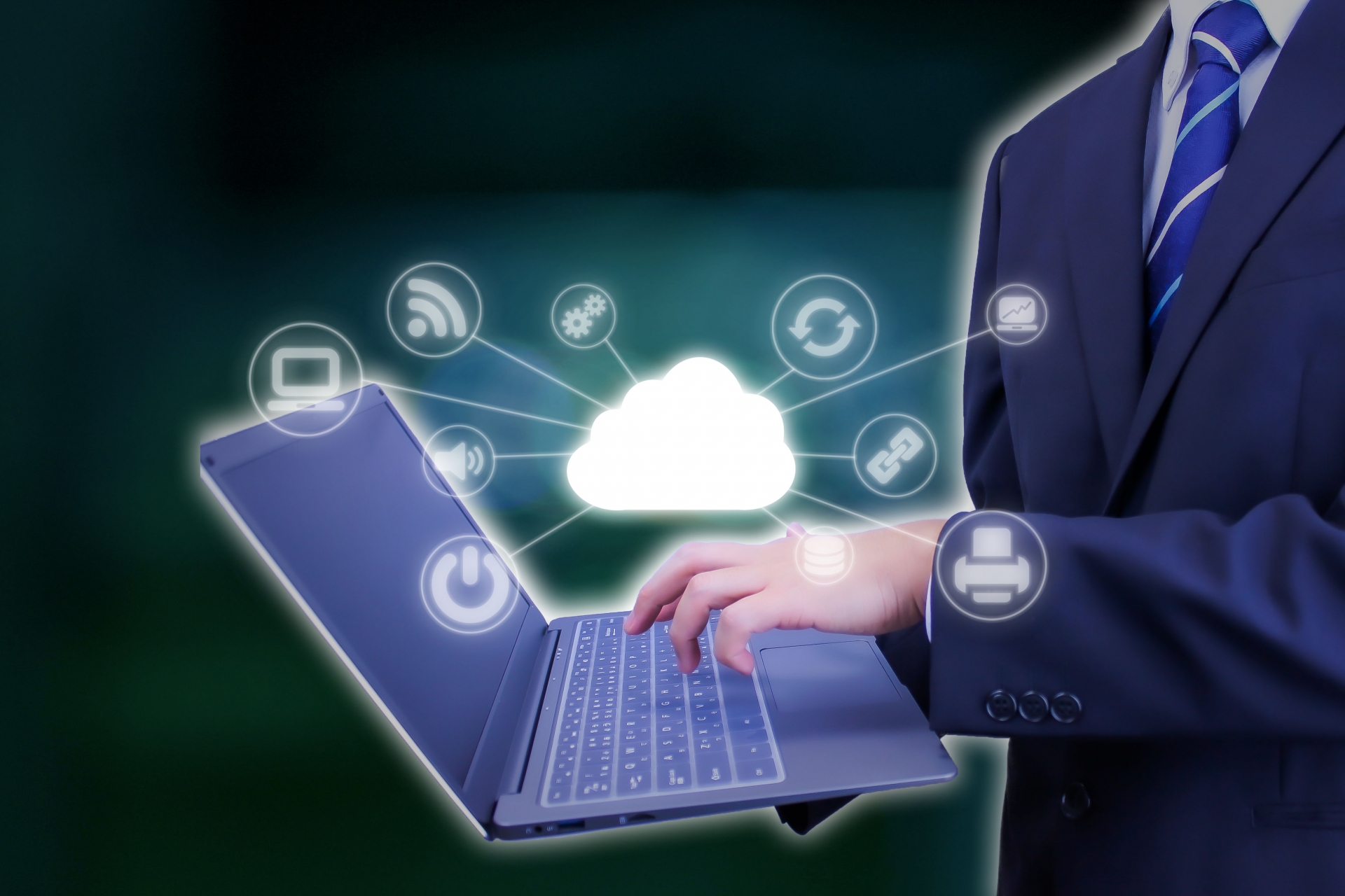 クラウドのイラストとパソコンを操作する手